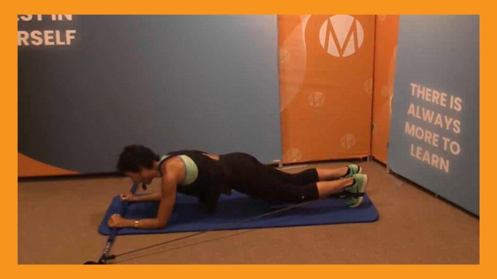 Marietta Mehanni performing a plank using a Gymstick resistance tool. Blog by Marietta for a Gymstick Guide to Abdominal Strength